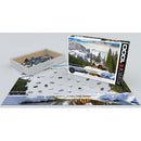 A 1000-piece jigsaw puzzle titled 'Yoho National Park British Columbia' by Eurographics, featuring a scenic landscape with mountains, a lake, and trees. The box is partially opened, revealing colorful puzzle pieces arranged next to the layout of the partially completed puzzle on a flat surface.