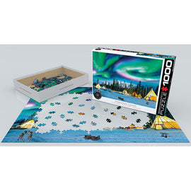 A jigsaw puzzle titled 'Northern Lights, Yellowknife' by Eurographics, featuring stunning artwork of the aurora borealis over a scenic landscape. The puzzle is displayed partially completed with pieces scattered around it, and the box is open beside it. The design showcases vibrant colors and intricate details that capture the beauty of the northern lights.