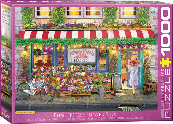 Plush Petals Florist jigsaw puzzle by Eurographics featuring a charming flower shop scene. A young woman in a sun hat stands admiring the vibrant floral display outside, surrounded by colorful flowers and plants. The flower shop has a quaint facade with a striped awning and cozy lights, exuding a delightful atmosphere of springtime blooms.