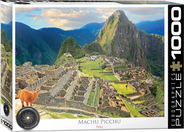 A picturesque jigsaw puzzle featuring the iconic Machu Picchu in Peru. The image showcases detailed stone structures surrounded by lush mountains, with a llama in the foreground. The packaging indicates it contains 1000 pieces, designed by Eurographics.