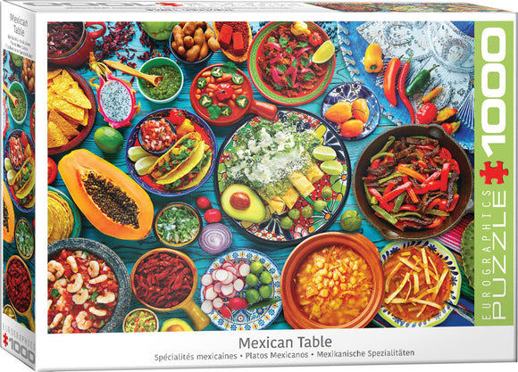 Colorful jigsaw puzzle box featuring a vibrant Mexican table filled with an array of traditional dishes, including tacos, guacamole, and various vegetables, along with a backdrop of bright tableware.