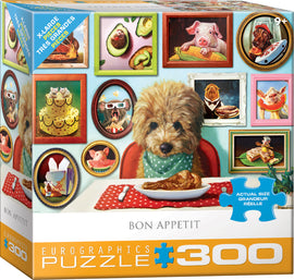 Bon Appetit jigsaw puzzle by Eurographics, featuring a whimsical dining scene with a dog wearing a green bandana sitting at a table with food. The background includes framed pictures of various animals and food items, highlighting a playful and artistic theme. Suitable for ages 9 and up, this 300-piece puzzle offers large, easy-to-handle pieces, perfect for puzzle enthusiasts or family fun.