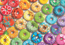 A colorful arrangement of donuts featuring various icing and toppings, including sprinkles, fruit pieces, and chocolate drizzles. Each donut showcases a unique design and vibrant colors, making it a visually appealing jigsaw puzzle that captures the delightful essence of sweets.