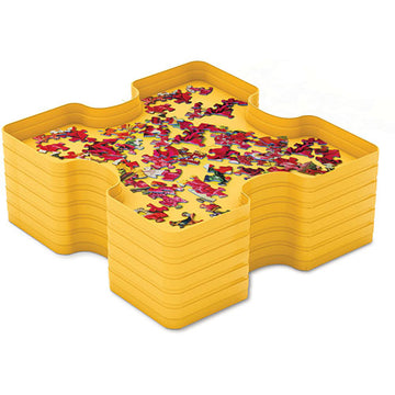 A Sort & Store Tray Set for jigsaw puzzles by Eurographics, featuring multiple interlocking yellow trays designed for organizing puzzle pieces during assembly. The trays display colorful jigsaw pieces in various shapes, enhancing puzzle organization and completion.