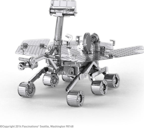 A detailed metal model of the Mars Rover, designed by Fascinations. The intricate structure showcases various components including solar panels, antennas, and wheels, all crafted from shiny metal for a modern look. This DIY kit allows enthusiasts to build their own replica of this iconic space exploration vehicle.
