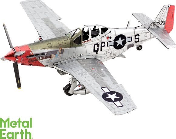 Close-up view of the Metal Earth Mustang P-510 Mus DIY model kit, showcasing intricate details of the metallic airplane, including the propeller, cockpit, and detailed paintwork featuring a red and silver design with a pin-up girl illustration. The model is set against a white background with the Metal Earth logo visible in green at the bottom.