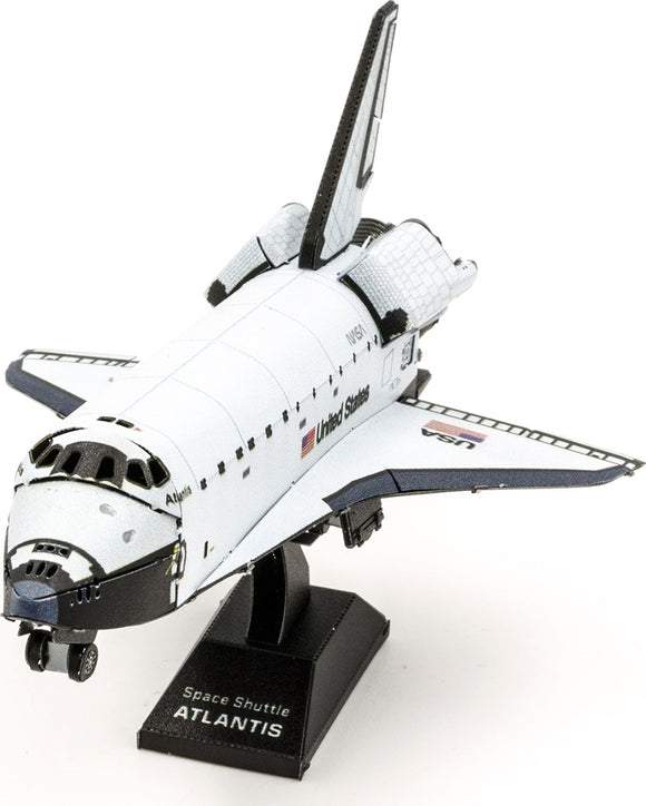 A detailed Metal Earth DIY kit of the Space Shuttle Atlantis, showcasing its iconic design with a white and blue color scheme. The model is displayed on a black base labeled 'Space Shuttle ATLANTIS,' capturing its intricate features and craftsmanship, perfect for space enthusiasts and model builders.