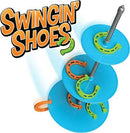 Swingin' Shoes game by Fat Brain features a colorful stacking design with vibrant discs and horseshoe-shaped rings. Players take turns swinging rings onto the pegs for interactive fun.