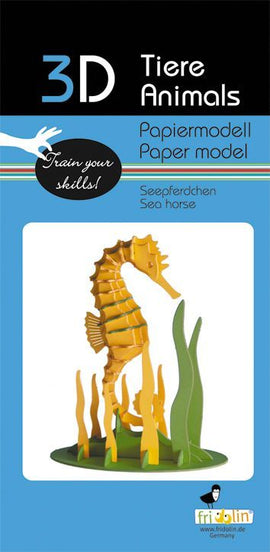 3D Paper Model Seahorse by Fridolin, featuring a vibrant yellow seahorse standing upright with colorful green and brown elements representing underwater vegetation. The kit promotes creativity and skill development through DIY paper modeling.