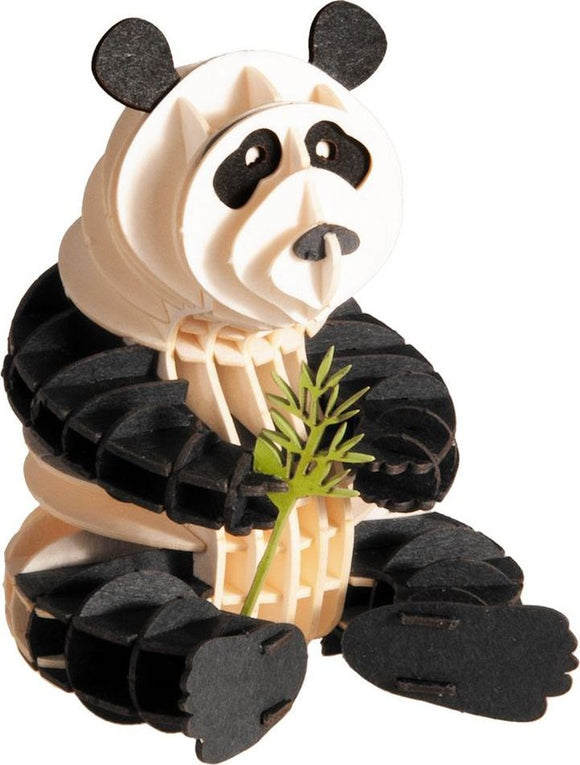 A detailed 3D paper model of a panda holding a piece of bamboo. The panda is crafted from layered paper, showcasing black and white colors and lifelike features. It is positioned sitting down, with a playful expression, making it an ideal decoration or DIY craft project for animal lovers.