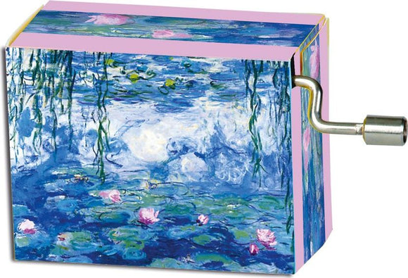 A beautifully designed music box featuring Claude Monet's iconic 'Nympheas' painting. The box is intricately decorated in shades of blue and pink, with vibrant water lilies and calming water reflections. A metal winding mechanism extends from the side, inviting interaction as it plays a melodic tune. This charming piece serves as both a decorative art item and a delightful musical collectible.