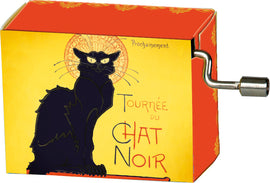 A yellow and orange music box featuring a black cat design, labeled 'Tournée du Chat Noir', with a winding mechanism on the side for playing music.