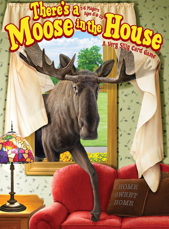 Gamewright's 'There's a Moose in the House' featuring a whimsical scene of a moose peering through a window. The box design highlights the fun and silly nature of this card game, suitable for 2-6 players aged 8 and up. Decor elements include a colorful lamp and a cozy red couch, enhancing the homey vibe.
