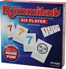 Rummikub: 6 Player Edition game box featuring colorful numbered tiles, including a distinctive smiling tile. The design showcases the brand and highlights that it is a special edition for 2-6 players aged 8 and up, emphasizing fun and togetherness.