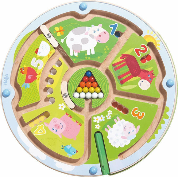 A colorful Magnetic Game Number Maze by HABA, featuring animal illustrations like a cow, horse, pig, and bird. It has numbered sections and colorful magnetic balls positioned in a triangular arrangement at the center. A green stylus is included for engaging gameplay, enhancing numerical and problem-solving skills in children.