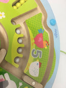The Magnetic Game Number Maze by HABA features colorful animals and numbers. It showcases a wooden base with vibrant elements including a red bird, a white chicken, and various beads that can move through the maze, promoting early learning and motor skills for young children.