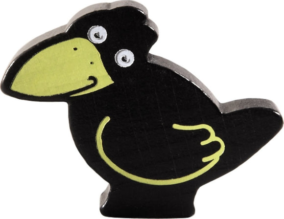 A colorful wooden crow game piece from the HABA USA game 'My First Orchard'. This quality-crafted crow has a black body and a bright green beak, perfect for early learners.