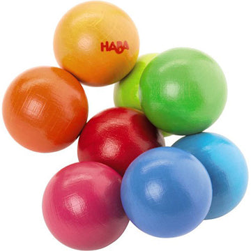 Colorful Clutching Toy Magica from Haba features a playful arrangement of nine wooden balls in vibrant colors including red, green, blue, orange, and purple, designed for sensory exploration and developmental play.