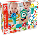 The Monster Math Scale by HaPe International features a colorful, playful design that engages young learners. The set includes various numbered monster pieces, interactive scales, and vibrant colors, helping children aged 3 and up explore basic math concepts through hands-on play. Two children are seen enjoying the toy, enhancing learning experiences in a fun, STEAM-focused approach.