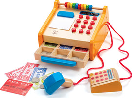 The Hape Checkout Register is a wooden toy designed to engage children in imaginative play. It features a colorful cash register with a numeric keypad, a digital display, and an abacus on top. The register includes a functional drawer containing toy banknotes and coins, encouraging financial literacy through play. A wooden card reader with a debit-like card is attached by a red cord, adding to the interactive experience. Ideal for developing math skills and creative role play.