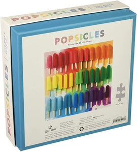 Mudpuppy Rainbow Popsicles jigsaw puzzle featuring a vibrant image of assorted colorful popsicles on a box. The puzzle measures 20 x 20 inches and contains 500 pieces, perfect for both kids and adults. The packaging highlights the bright, cheerful illustrations and includes safety warnings for small children.