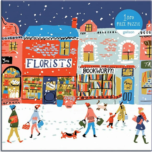 A colorful illustration of a winter street scene featuring a florist and a bookstore named 'Bookworm.' Snowflakes fall as shoppers stroll by with bags, including a person walking a dog.