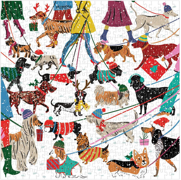 A colorful jigsaw puzzle featuring various breeds of dogs in winter attire. Dogs are depicted on leashes, wearing festive hats and outfits, with a cheerful winter scene background. The illustration captures a vibrant community walk with playful detailing, perfect for dog lovers and puzzle enthusiasts alike.