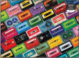 Colorful assortment of vintage cassette tapes on a jigsaw puzzle, featuring various designs and colors. Ideal for music lovers and puzzle enthusiasts, the puzzle consists of 1000 interlocking pieces, providing a challenging and engaging activity.
