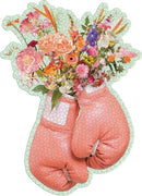 A colorful jigsaw puzzle shaped like a pair of boxing gloves filled with a vibrant arrangement of flowers, including pinks, yellows, and greens, capturing a playful and artistic design. Perfect for puzzle enthusiasts and floral lovers alike.