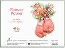 Flower Power Shaped Puzzle by Galison featuring a unique design of pink boxing gloves adorned with vibrant flowers. It contains 750 pieces, showcasing a colorful artistic presentation that adds a pop of joy to any puzzle collection.