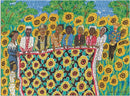 A vibrant jigsaw puzzle featuring a colorful illustration of several figures surrounded by sunflowers. The scene depicts a group of women holding a large quilt adorned with sunflowers, set against a backdrop of lush greenery and a blue sky.