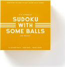 Sudoku With Some Balls game box by Chronicle Books, featuring a bright yellow design with bold white text. The package includes 81 colored balls, a game book, and a travel board for easy play. Perfect for relaxing alone or with friends, combining the classic Sudoku challenge with a fun twist.
