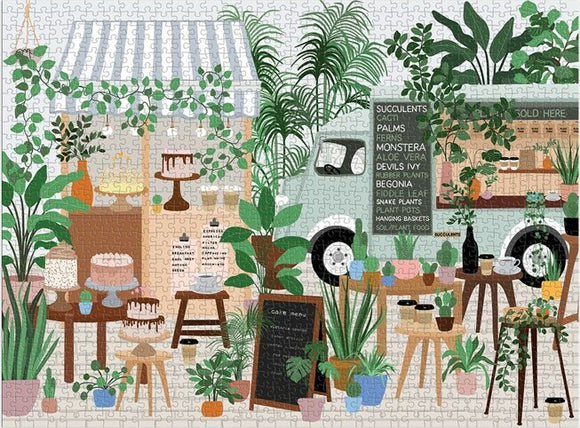 A vivid jigsaw puzzle showcasing a charming plant cafe scene filled with various indoor plants, signed menus, a vintage truck, and a table with cakes. The colorful arrangement features succulents, cacti, and ferns, creating a cozy atmosphere perfect for plant lovers.