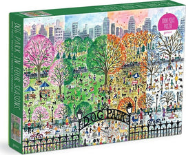 A vibrant jigsaw puzzle titled 'Dog Park in Four Seasons' by Galison, featuring a colorful illustration of a dog park in different seasonal settings. The scene shows people and dogs enjoying the park, surrounded by lush trees in pink, green, orange, and white shades, with a city skyline in the background. The puzzle has 1000 pieces and the box displays a whimsical design.