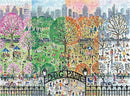 A colorful jigsaw puzzle depicting a vibrant dog park across four seasons. The left side shows a blooming spring scene with pink and green trees, while the center illustrates a lively summer filled with dogs and people. The autumn section features warm oranges and yellows, and the winter part is covered in soft snow. The scene is bustling with activity, showcasing various people enjoying the park with their pets. The entrance gate labeled 'Dog Park' adds to the charm of this delightful image.
