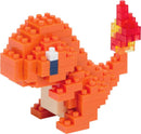 A colorful Nanoblock Charmander model made of small, interlocking plastic blocks. The figure features an orange body, a white belly, a blue eye, and a flame-like tail made of red and yellow blocks, showcasing intricate detailing for a DIY building experience.