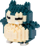 A detailed view of a Nanoblock Snorlax DIY kit, showcasing a small, blocky, and colorful representation of the popular sleeping Pokémon. The figure features Snorlax's signature rounded body, green back, and pale belly made of various interlocking blocks, ideal for builders and Pokémon fans alike.