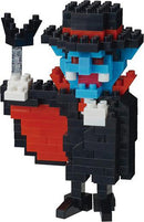 A colorful Nanoblock Vampire figure crafted from small interlocking building blocks. The vampire features a blue face, red cape, and a black suit with a top hat. He holds a small item in one hand, embodying a playful and whimsical design perfect for collectors and fans of DIY projects.