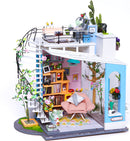 Dora's Loft DIY Model Kit by Robotime. This detailed miniature model features a two-story design with a cozy living room, a stylish bookshelf, a pink armchair, and a rooftop deck adorned with potted plants. Intricate details such as wall art and decorative items enhance the charm, making it an ideal DIY project for hobbyists.
