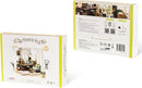 SOHO Time DIY Miniature House Model Kit by Robotime, featuring a beautifully designed miniature room with intricate details and accessories. The kit is ideal for DIY enthusiasts who enjoy crafting and building their own miniature spaces. The box shows illustrations of the completed model with a cozy and stylish aesthetic, perfect for display or gifting.