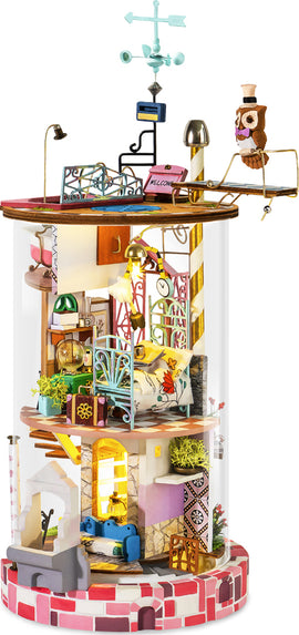 A beautifully crafted Bloomy House Model Kit by Robotime, featuring detailed miniature rooms adorned with furniture, plants, and a decorative owl. The model showcases intricate designs, vibrant colors, and a whimsical aesthetic. Perfect for DIY enthusiasts, this kit is ideal for creating a charming, decorative piece that adds personality to any space.