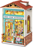The Free Time Bookshop Model Kit by Robotime is a detailed DIY model featuring a beautifully designed storefront with bookshelves, potted plants, and illuminated interiors. The kit includes intricate wooden pieces that create a charming miniature bookstore scene, perfect for hobbyists and craft enthusiasts looking to build a unique display.