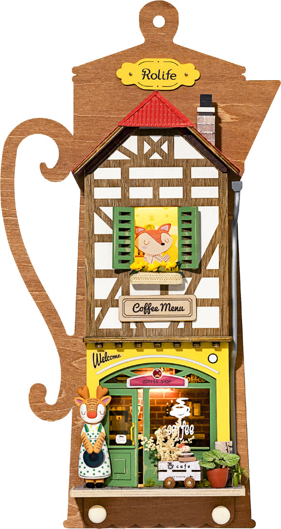 The Lazy Coffee House DIY kit by Robotime features a charming wooden coffee shop model with a detailed facade. It showcases a welcoming entrance, vibrant colors, and playful decorations, including a cute figure and a coffee menu sign. Ideal for hobbyists and crafting enthusiasts, this kit offers a relaxing build experience.