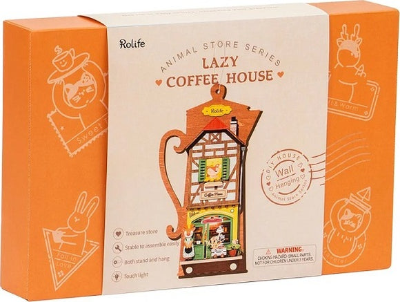 The Lazy Coffee House DIY kit by Robotime, featuring a charming coffee shop design within a decorative package. The box highlights its features including stable assembly, wall hanging capabilities, and a touch light. Ideal for creativity enthusiasts and collectors.