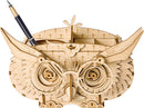 A detailed wooden Owl Storage Box 3D Build Kit by Robotime, designed as a DIY decorative organizer. The owl features intricate carvings, large expressive eyes, and compartments for storing pens and small items.
