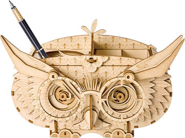 A detailed wooden Owl Storage Box 3D Build Kit by Robotime, designed as a DIY decorative organizer. The owl features intricate carvings, large expressive eyes, and compartments for storing pens and small items.