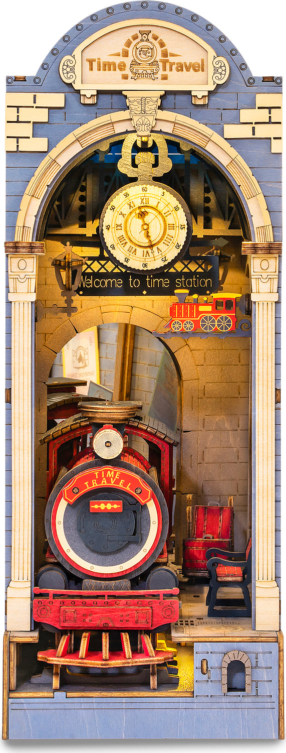 A beautifully crafted diorama of a time travel station featuring a red steam locomotive, intricate wooden details, and a clock with Roman numerals. The scene includes a welcoming sign, vintage benches, and decorative lights, making it an inviting and imaginative DIY project. Perfect for enthusiasts of model building and artistic displays.