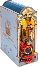 A detailed view of the Time Travel DIY Book Nook by Robotime, featuring a vibrant, intricately designed train inside an archway. The structure resembles a whimsical train station with a glowing clock, realistic textures, and various colorful elements, showcasing a nostalgic appeal for avid builders and imaginative readers alike. The overall aesthetic combines fun and creativity, making it an engaging DIY project.