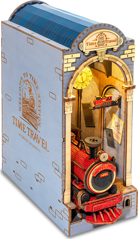 A detailed view of the Time Travel DIY Book Nook by Robotime, featuring a vibrant, intricately designed train inside an archway. The structure resembles a whimsical train station with a glowing clock, realistic textures, and various colorful elements, showcasing a nostalgic appeal for avid builders and imaginative readers alike. The overall aesthetic combines fun and creativity, making it an engaging DIY project.