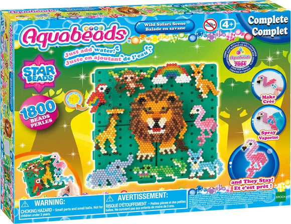 Aqua Beads Wild Safari Scene DIY kit featuring colorful beads to create a vibrant jungle scene including a lion, giraffe, elephants, and flamingos. The kit comes with 1800 beads and instructions for making fun designs by simply adding water to stick the beads together.